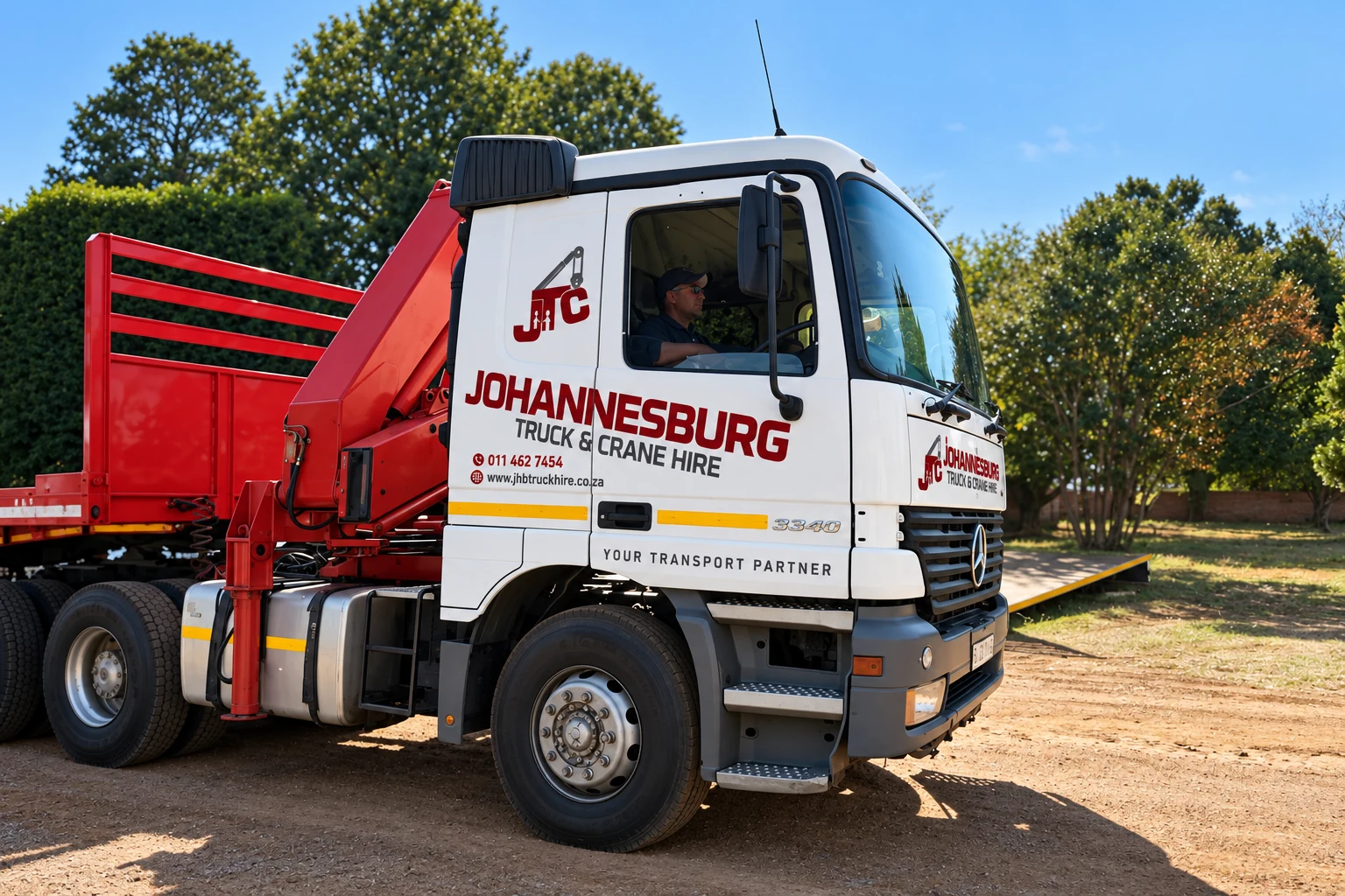 Enhanced JTC branded crane truck in the yard