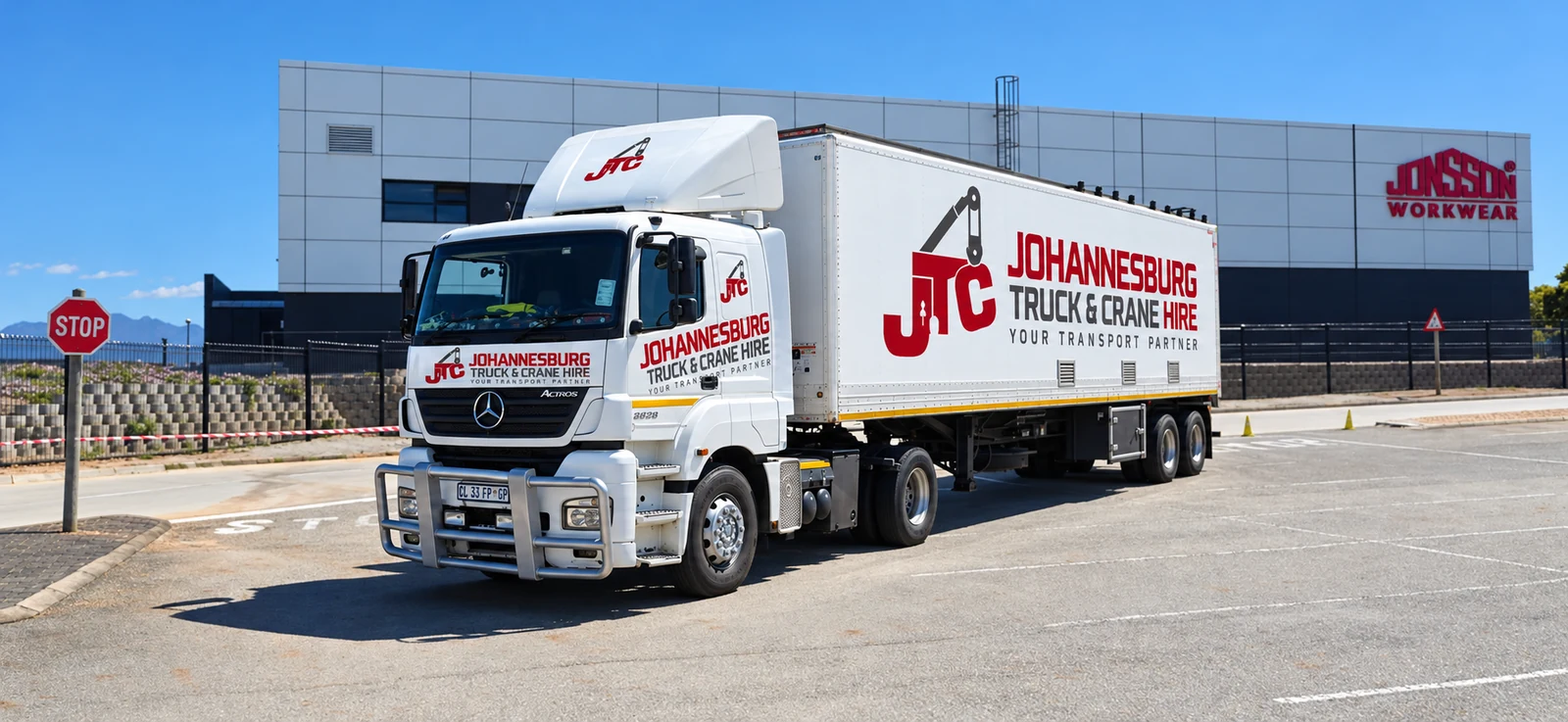 Enhanced JTC branded truck and curtainside trailer at commercial premises