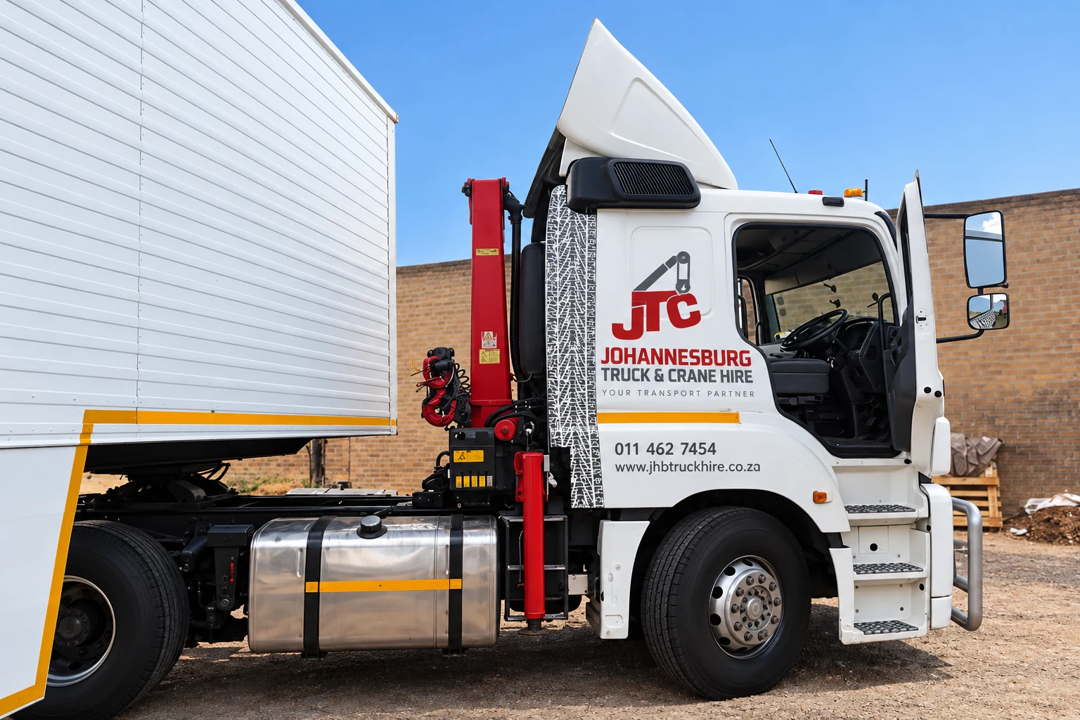 Enhanced JTC horse positioned beside a closed trailer