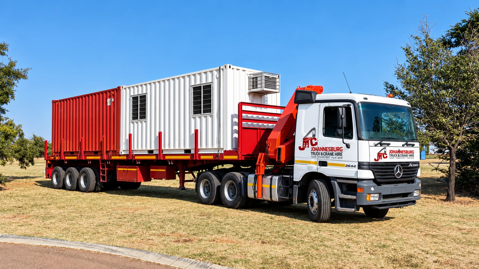Enhanced JTC flatbed carrying a loaded container