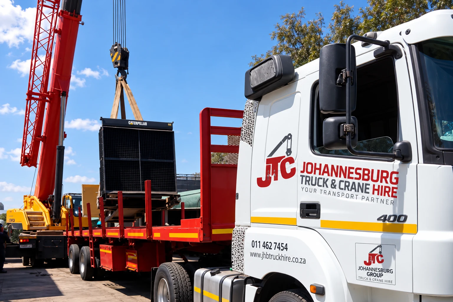 Enhanced JTC branded crane truck during machinery handling