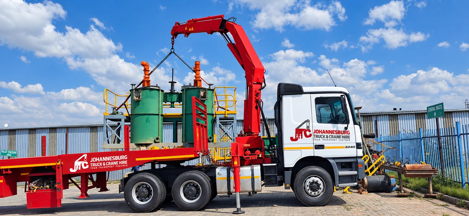 Enhanced JTC branded crane truck transporting plant equipment